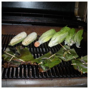 grilled fish in banana leaves grilled fish in banana leaves, plus grilled corn and romaine