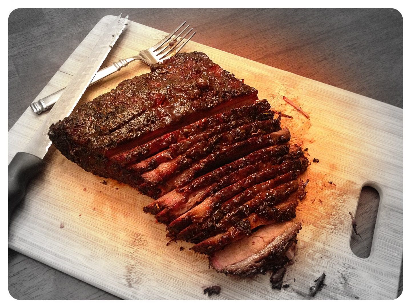 What is the best way to cook beef brisket on the grill?