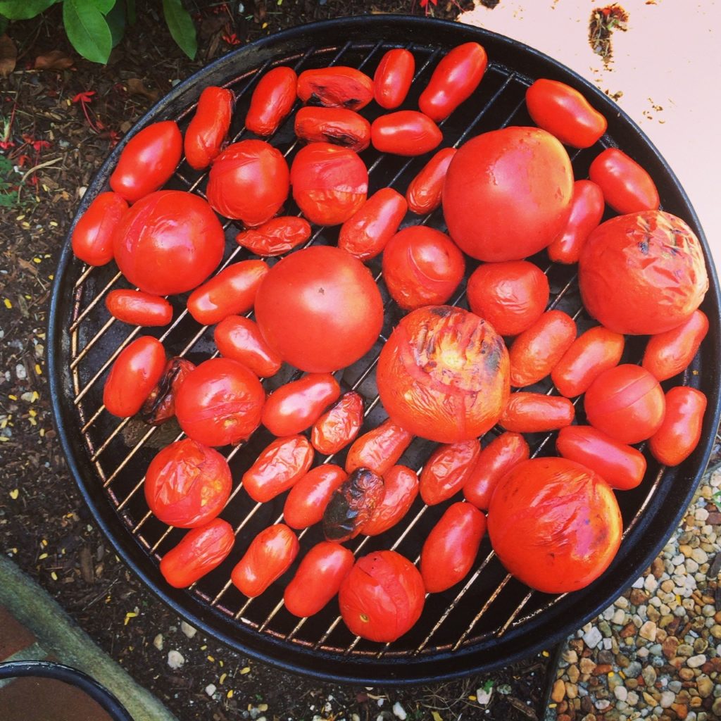 Round one- tomatoes on the grill. Ive been using my Weber Smokey Joe a lot lately due to the craziness that is going on in my backyard. I am LOVING the smokey flavor of this little grill!
