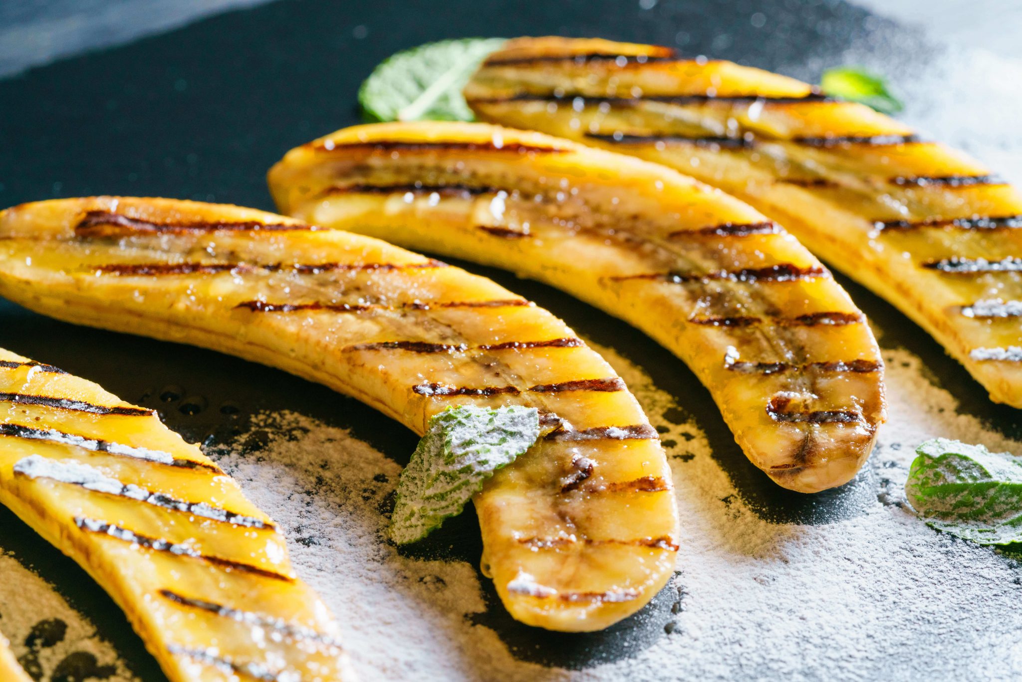 Grilled cinnamon sugar bananas on a plate