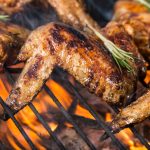 Grilled chicken wings on fire