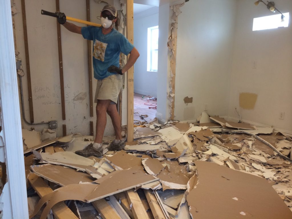 This is what used to be our bathroom (husband Scott holding the sledgehammer)