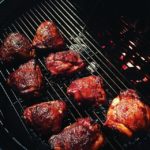 grill girl, smoked chicken thighs, cooking on a weber kettle grill