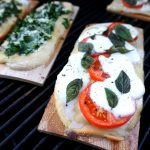 cedar planked pizzas on the grill