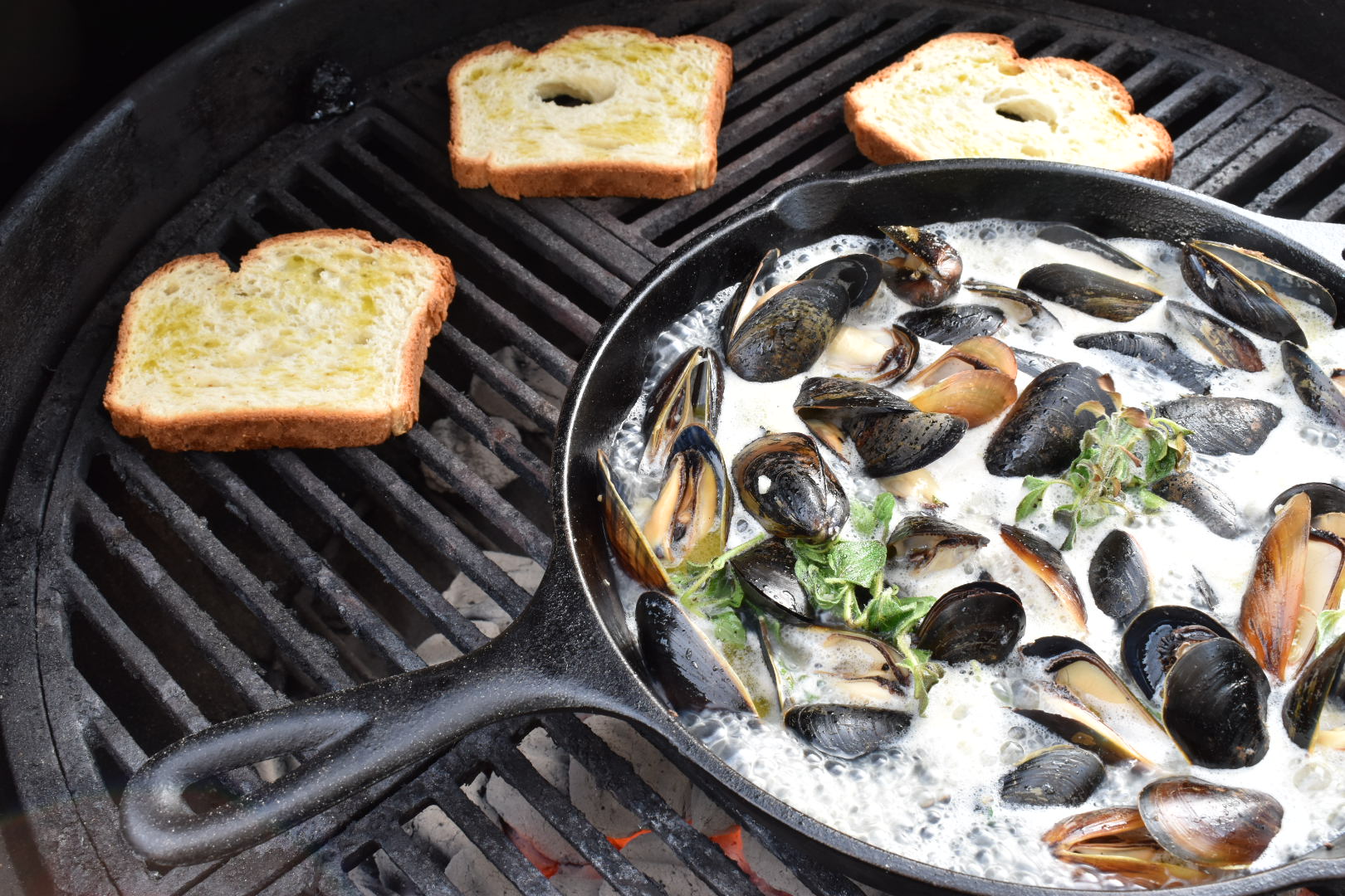 Cast Iron Grilled Mussels in a White Wine, Bacon Herb Butter Sauce