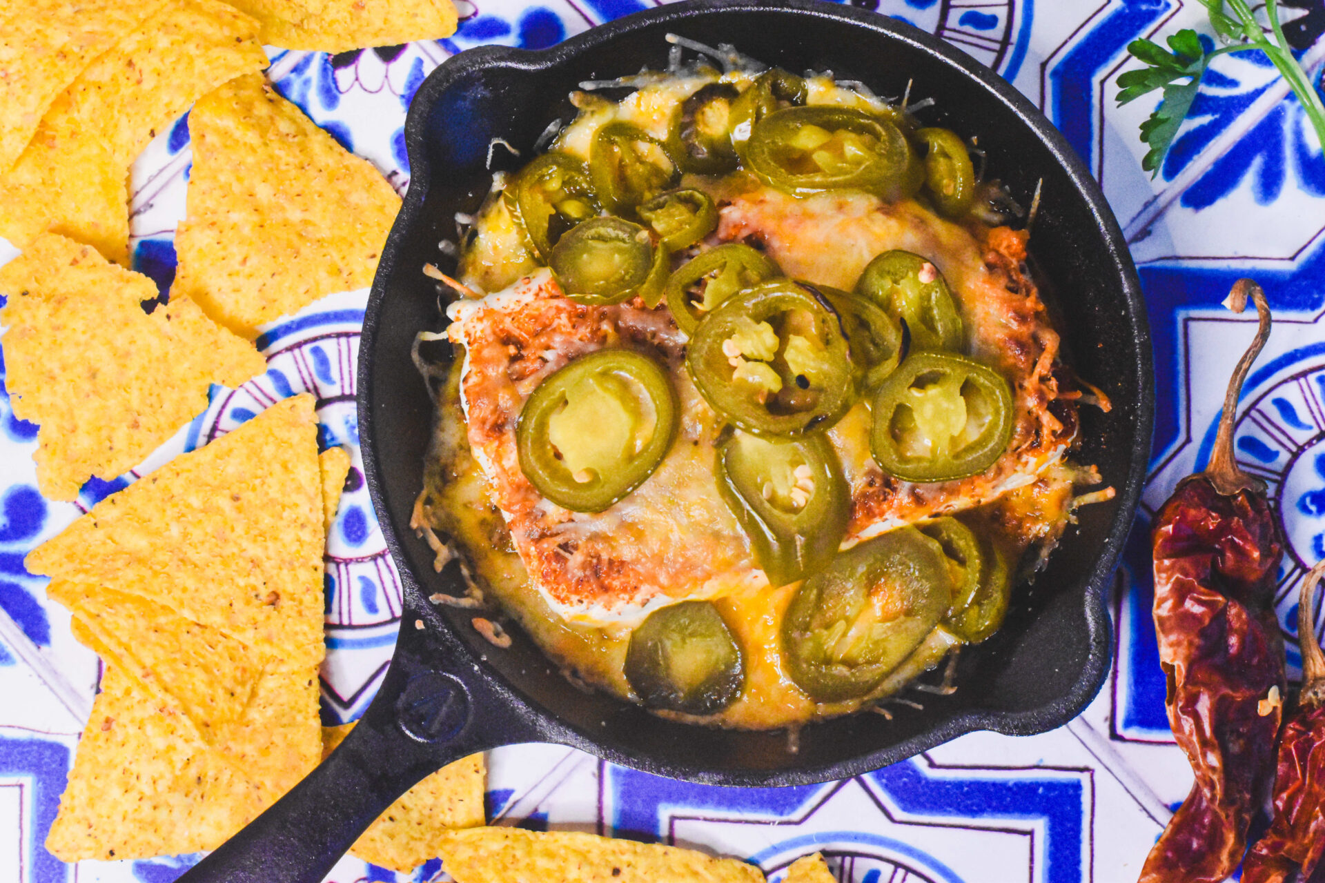 Taco dip smoked cream cheese topped with jalapeños.